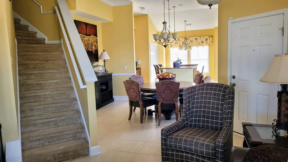 View from living room of kitchen and washing machine area behind double doors