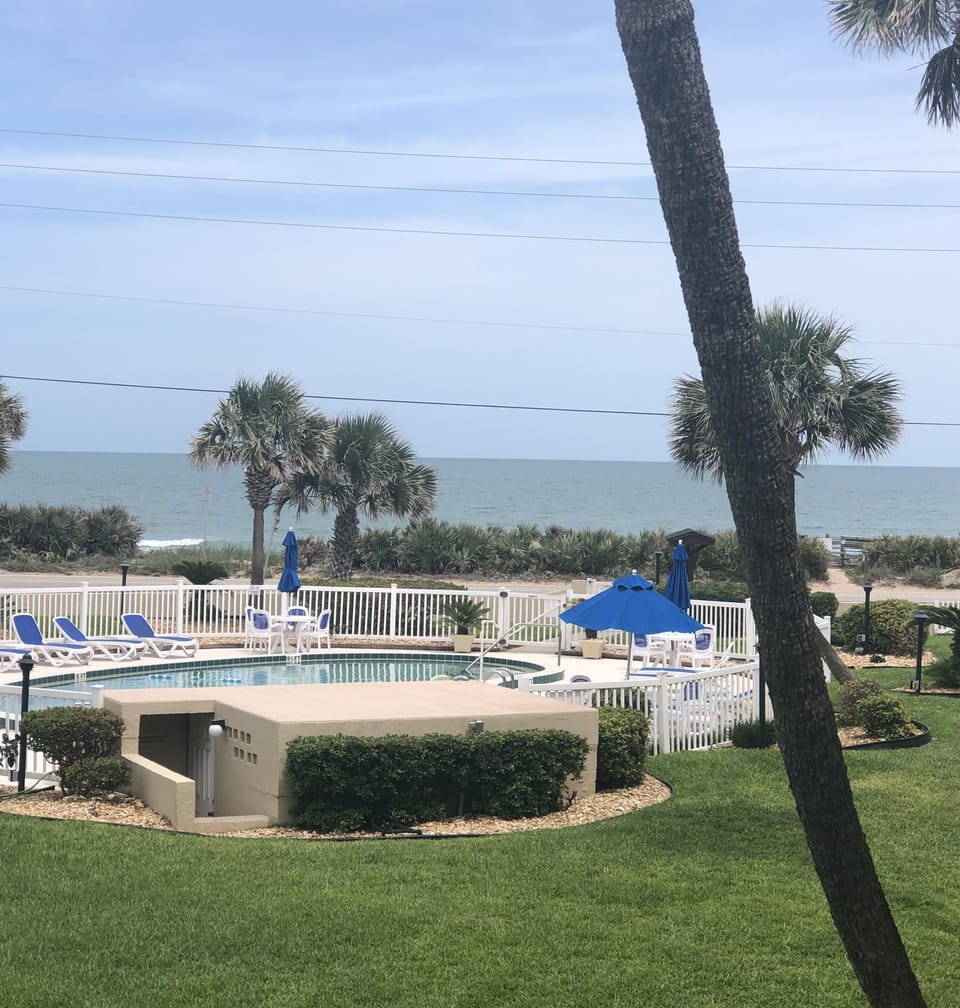 Balcony view of the waves over our sparkling pool 