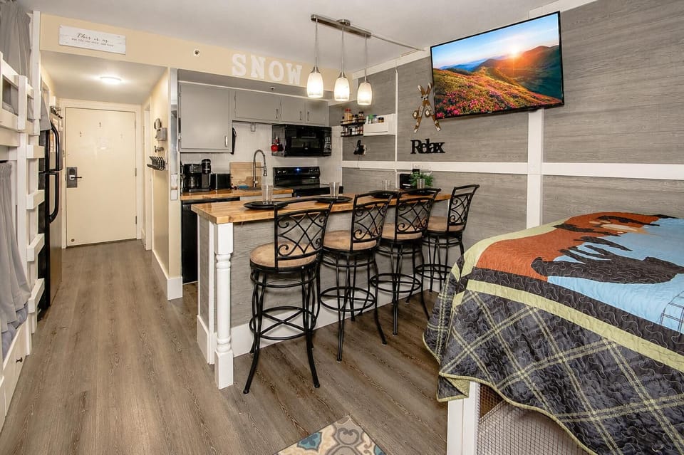 The kitchen island provides seating for four Guests.
