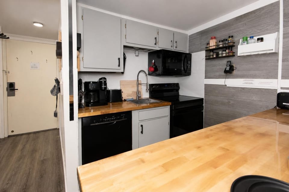 The fully equipped kitchen has everything you need to prepare snacks or full meals, along with both a drip coffee maker and a Keurig for your morning brew.
