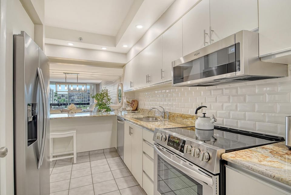 Bright, modern kitchen with sleek appliances and ample storage