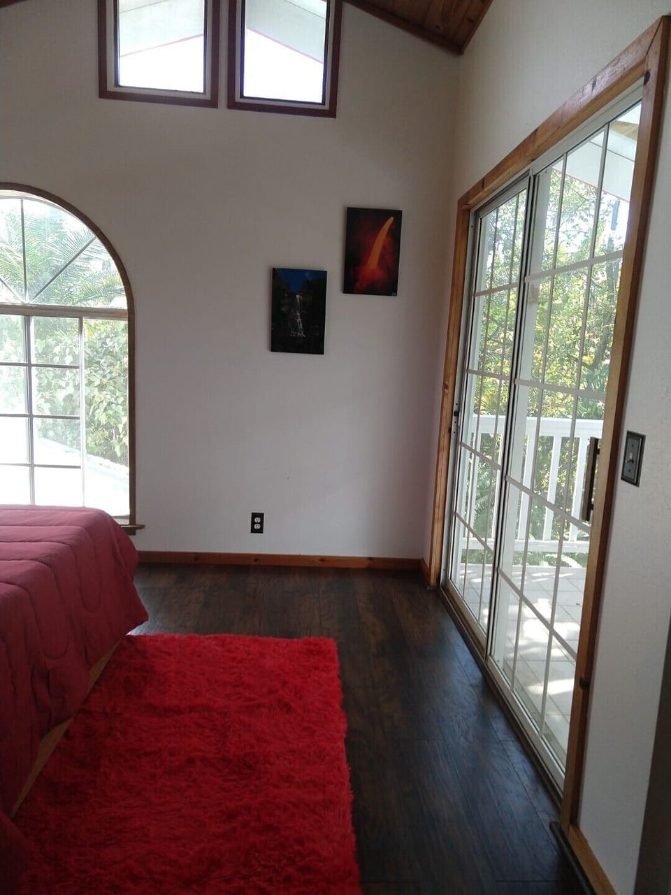 Upstairs suite master bedroom with adjacent lanai at right.