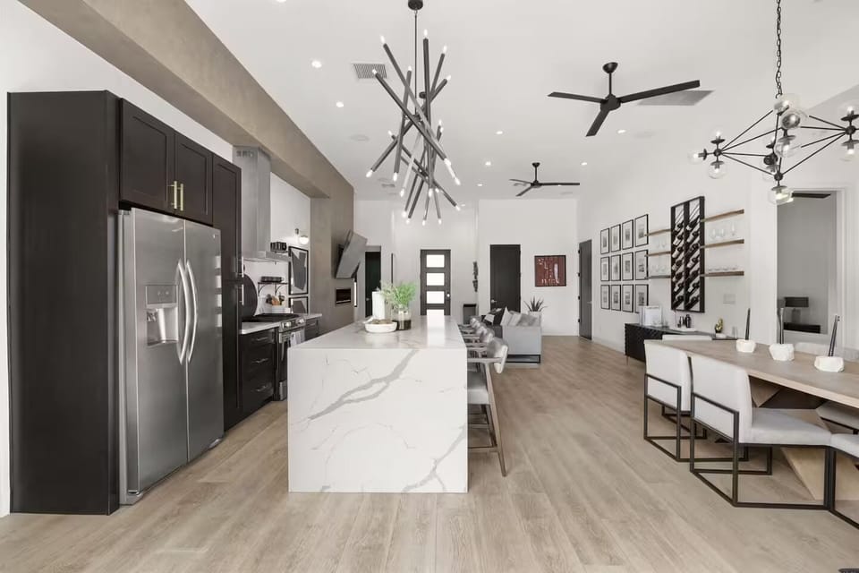 Chef's kitchen open to dining and living