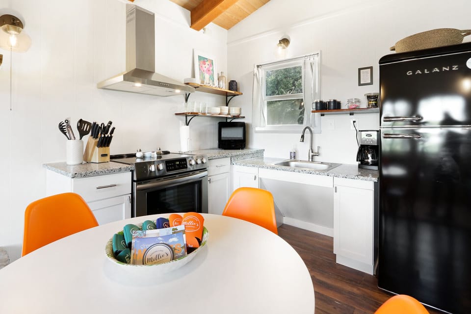 Full kitchen with stove, oven, refrigerator, microwave, and coffee maker