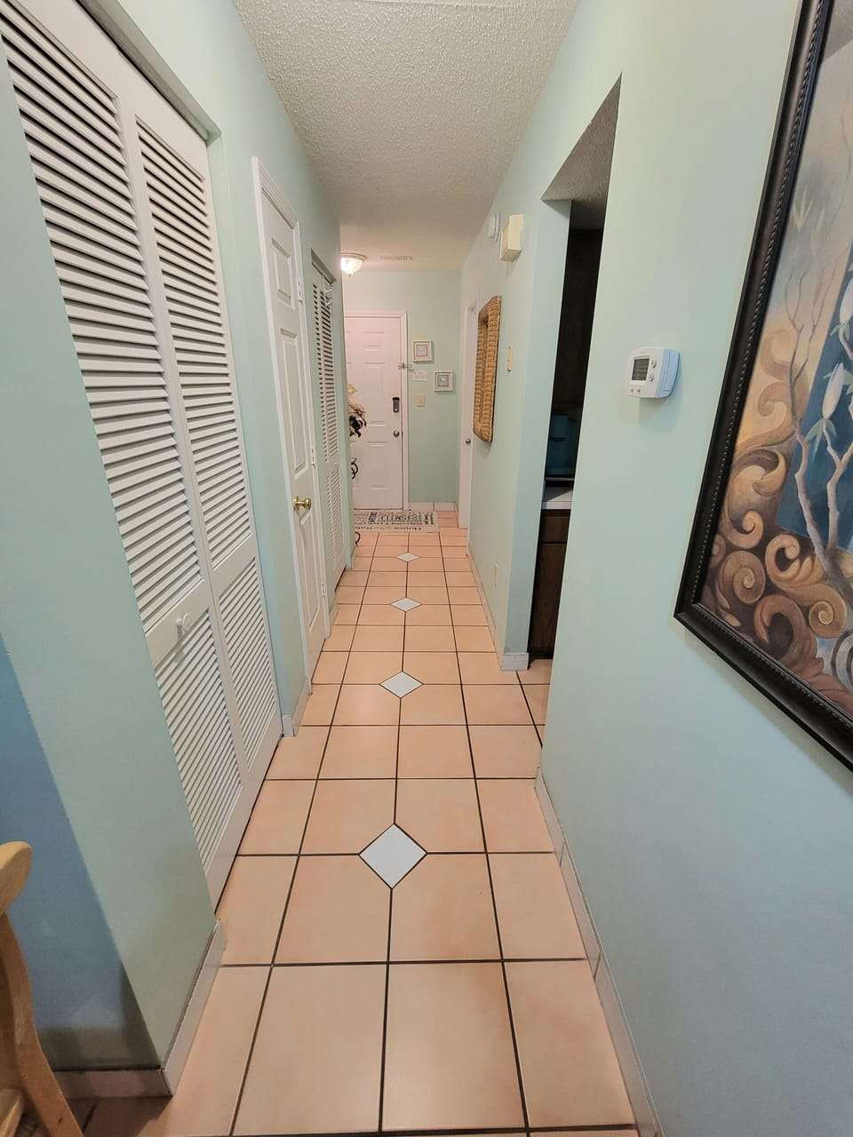Hallway toward kitchen and bathroom 