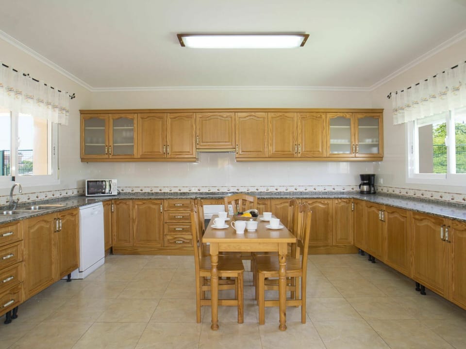 Countertop, Cabinetry, Furniture, Window, Sink, Kitchen, Tap, Wood, Lighting, Interior Design