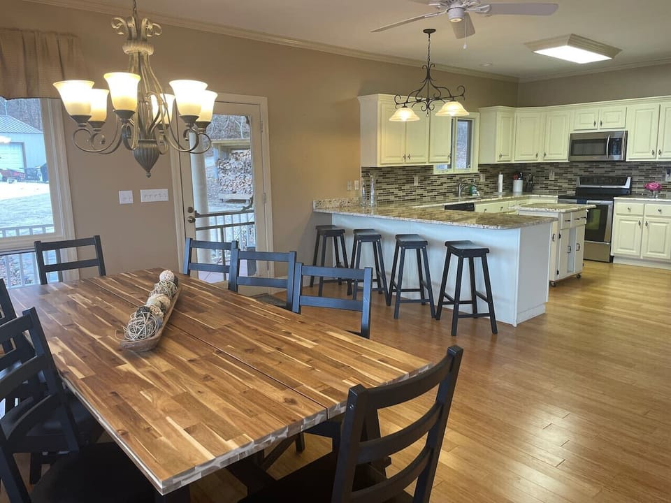 Open dining and kitchen area with combined seating