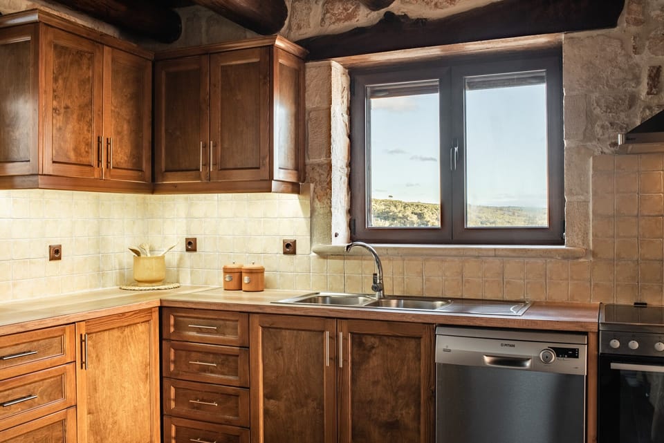 The spacious kitchen is ideal to welcome guests for a self-catering stay.