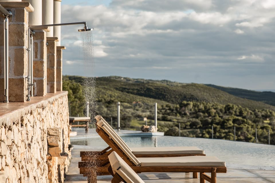 An outdoor shower is also available next to the pool