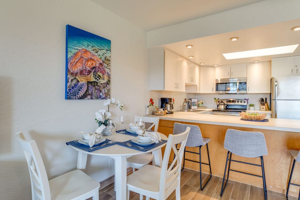 Dine al fresco on the lanai or indoors at this table for 3