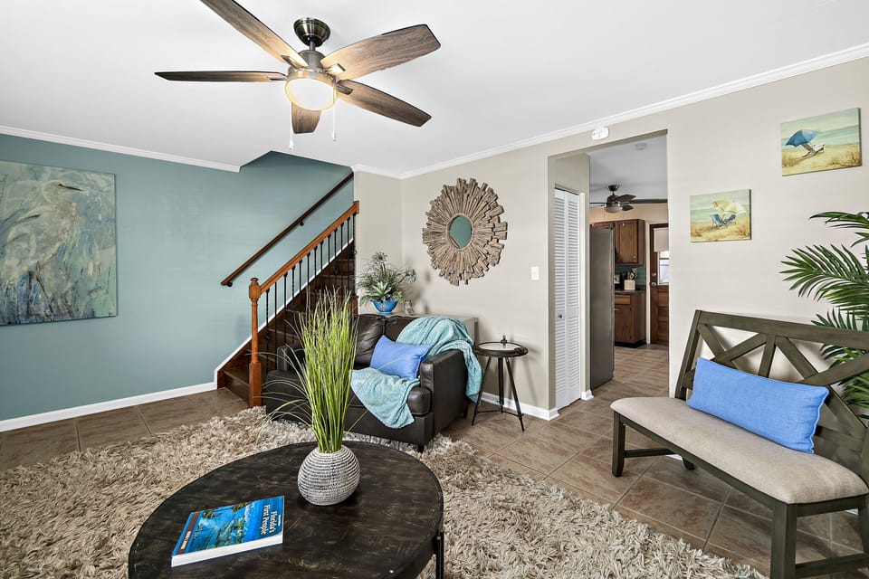 Baja living room stairs leading to 3 upstairs bedrooms and full bath