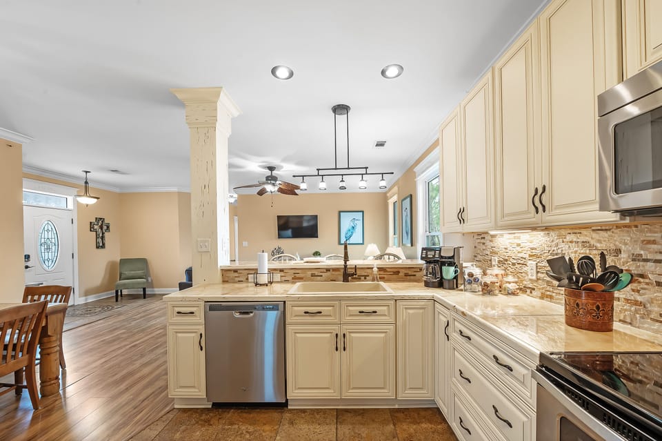 Open kitchen/dining/living areas.