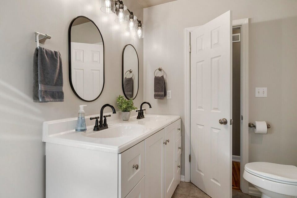 Convenience and comfort are key in our sleek and modern half bathroom, perfect for quick touch-ups and on-the-go guests