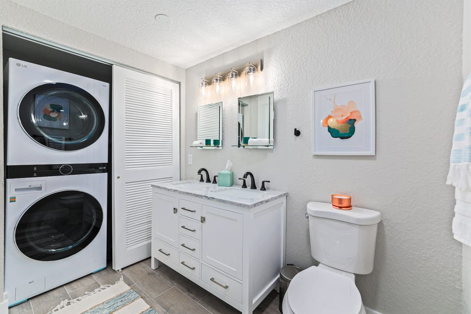 A thoughtfully designed ensuite with the added ease of in-home laundry