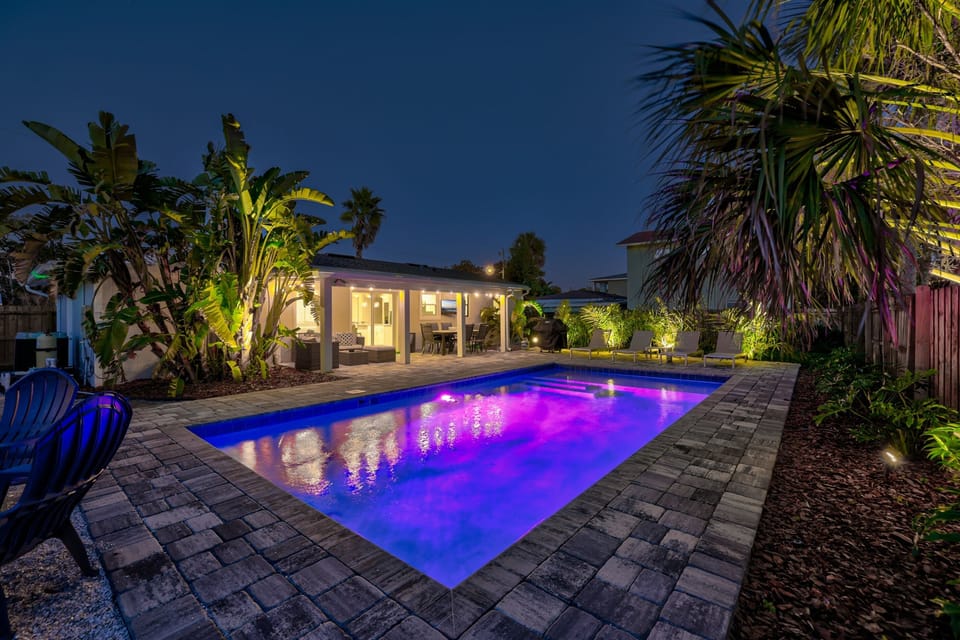 Backyard lit up at night for resort style vibes