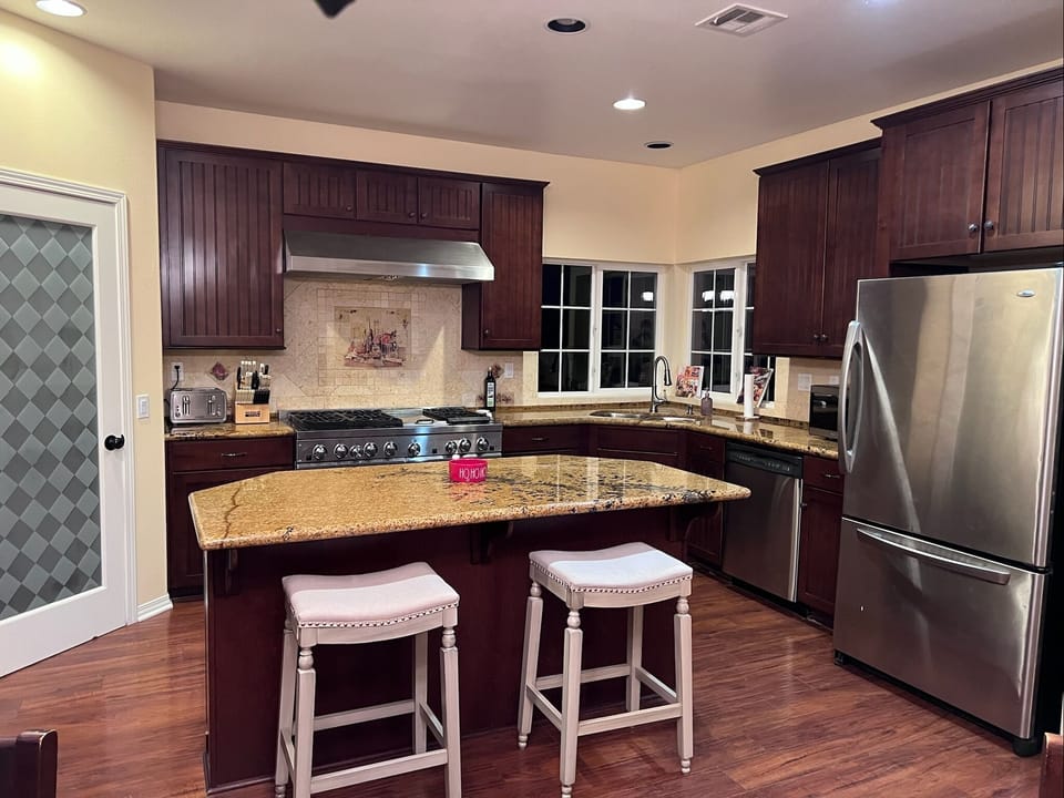 2nd Floor: HUGE Kitchen with full-size fridge & 6 burner stove with a griddle
