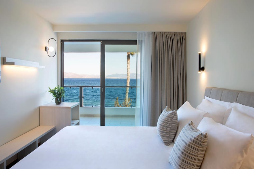 Family Room, 1 Bedroom, Sea View | In-room safe, desk, laptop workspace, blackout drapes