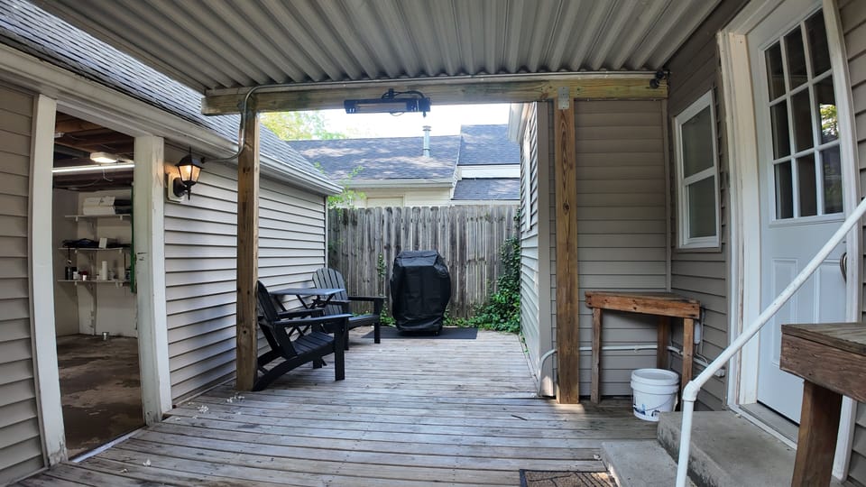 Private fenced deck with outdoor dining
