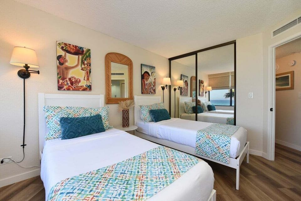 Guest bedroom features 2 twin size beds that can be converted into king