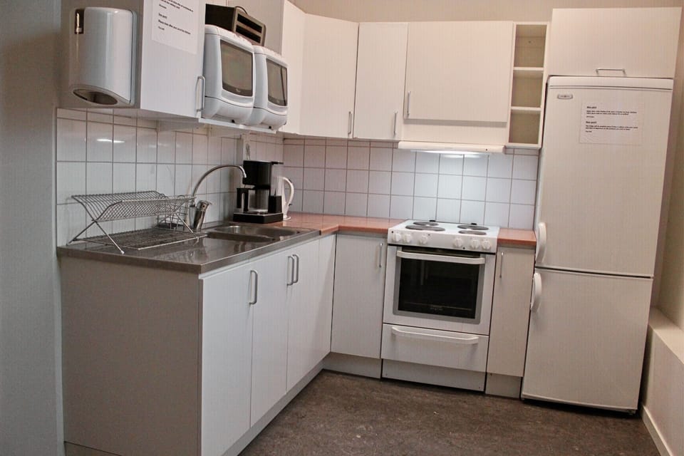 Economy Quadruple Room (shared bathroom) | Desk, WiFi (free), bed sheets