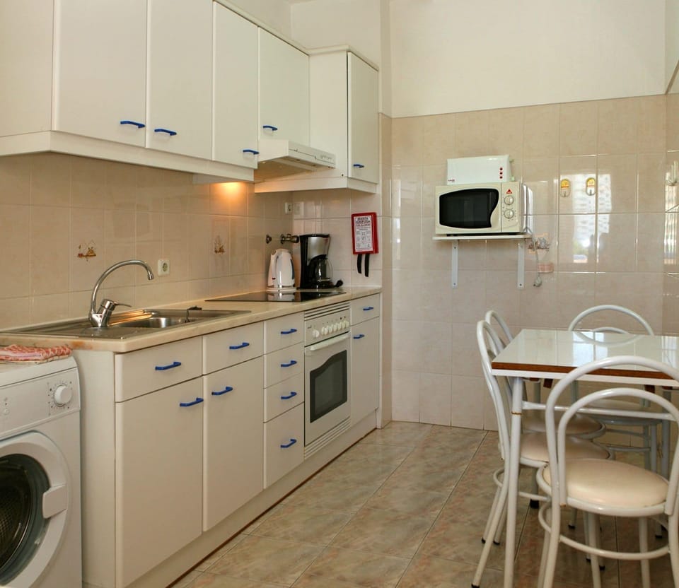 Apartment, 2 Bedrooms | Private kitchen | Fridge, microwave, coffee/tea maker