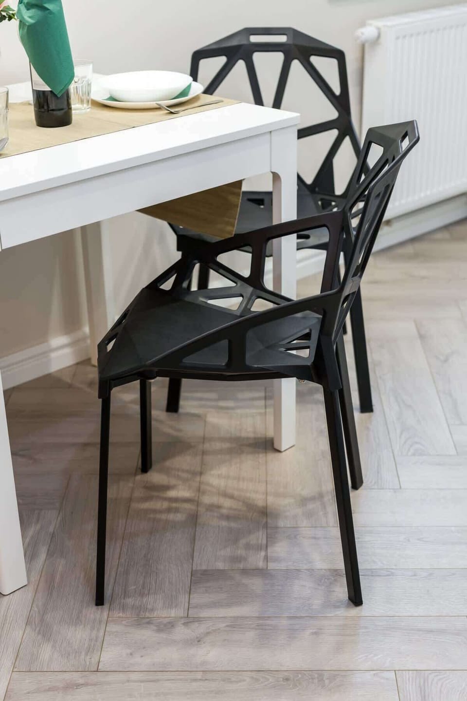 A dining area with a stylish table and chairs, perfect for small gatherings.
