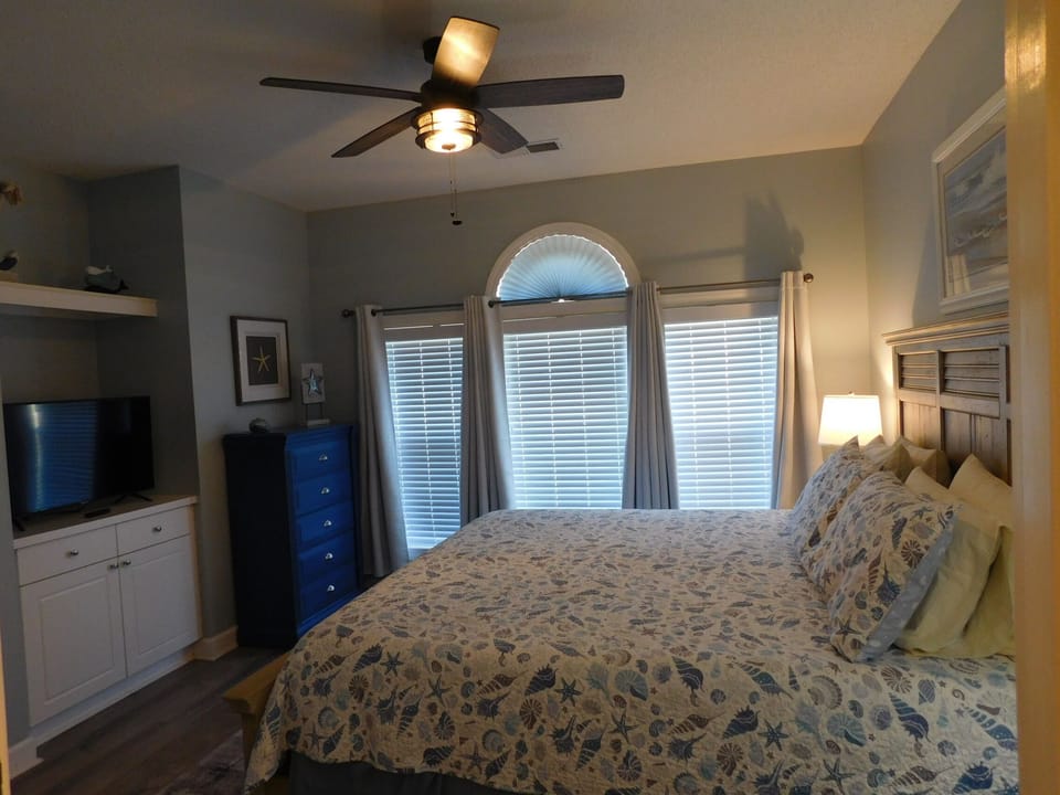 Primary Bedroom with King Size Bed and TV