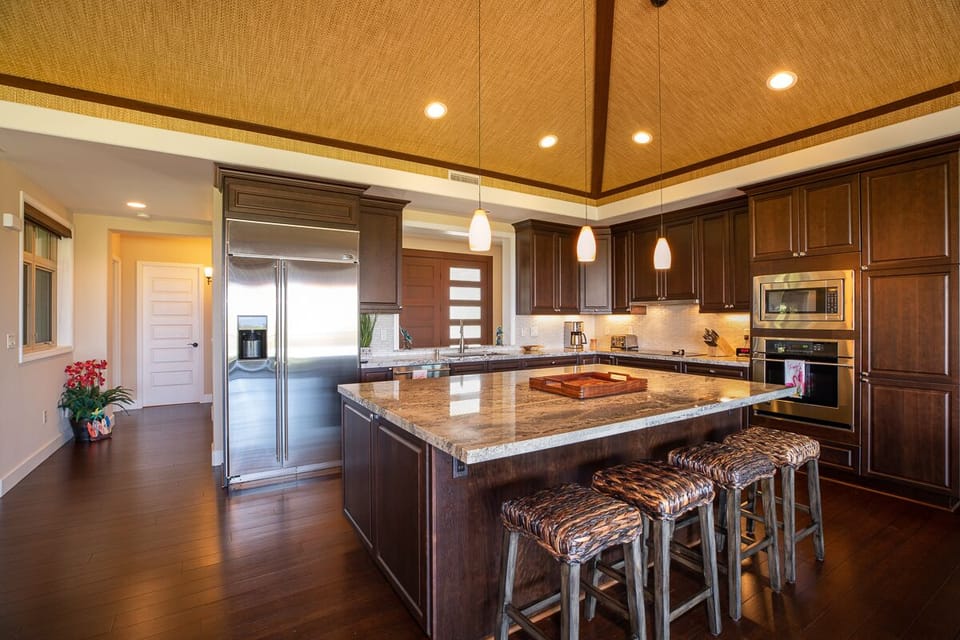 Large, open kitchen with stainless steel appliances.