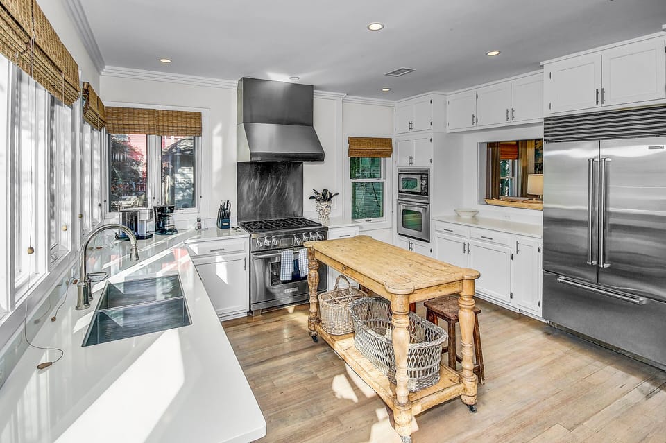 Chef's Kitchen with Natural Lighting, Breakfast Seating, and Professional Grade Appliances