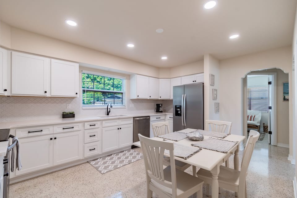 Spacious remodeled spacious kitchen fully stocked with pots and pans and dishes 