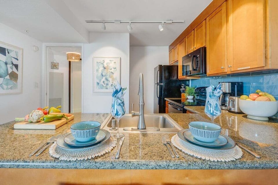 Black appliance and quartz countertops featured in your kitchen