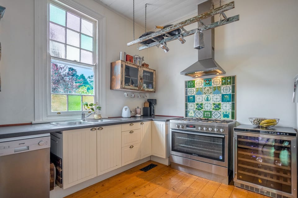 Kitchen with large oven, dishwasher and Smeg appliances