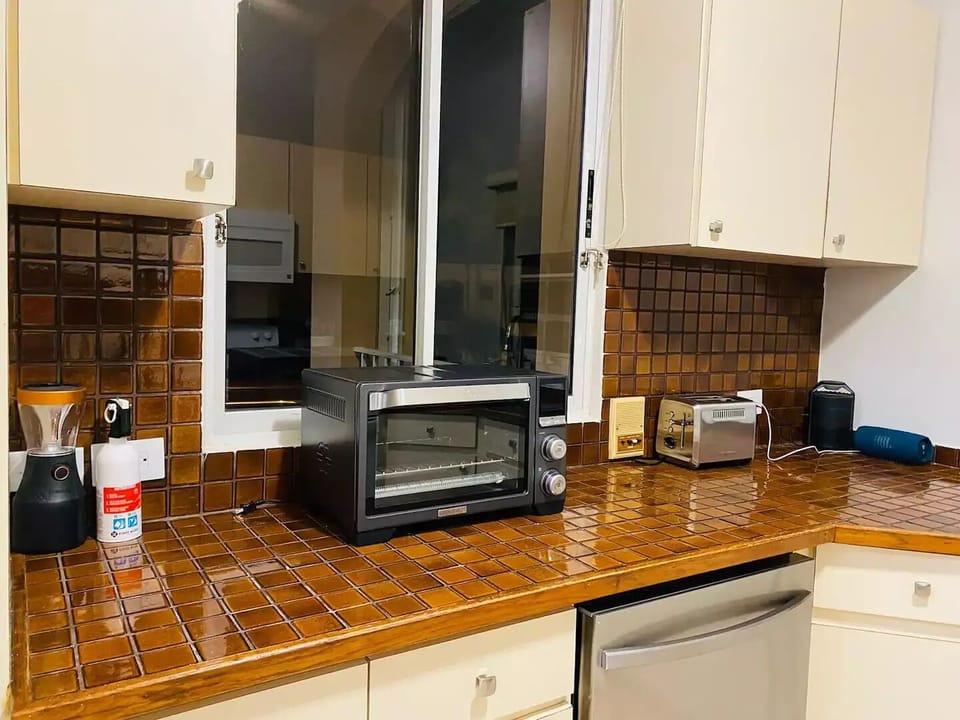 Spacious kitchen with window equipped with everything necessary