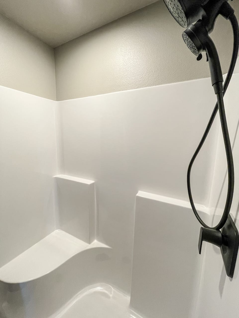Master bathroom with seat. 