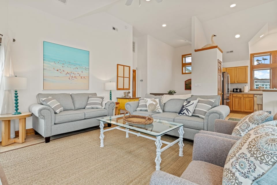 Seaside family room with cozy sofas and beachy charm!