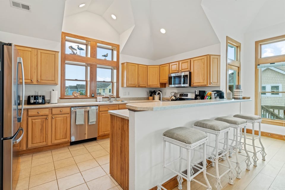 Cook up a storm in this bright kitchen, where natural light seeps in!