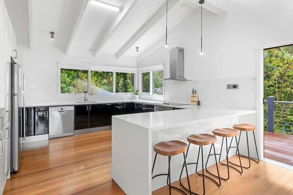 The fully renovated kitchen is a delight for home chefs, with high-end stainless-steel appliances, a custom Wathaurong glass splashback