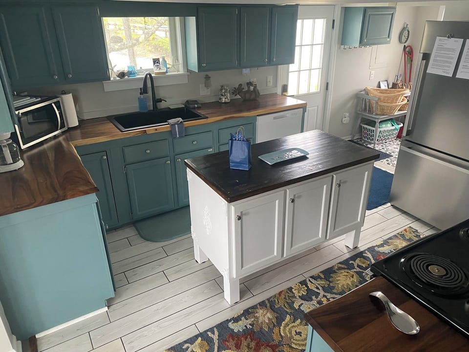 Love to cook? The butcher block topped island makes the kitchen super functional
