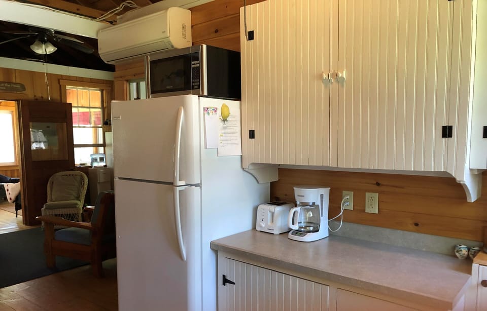 Kitchen includes all necessary appliances, dishware and utensils