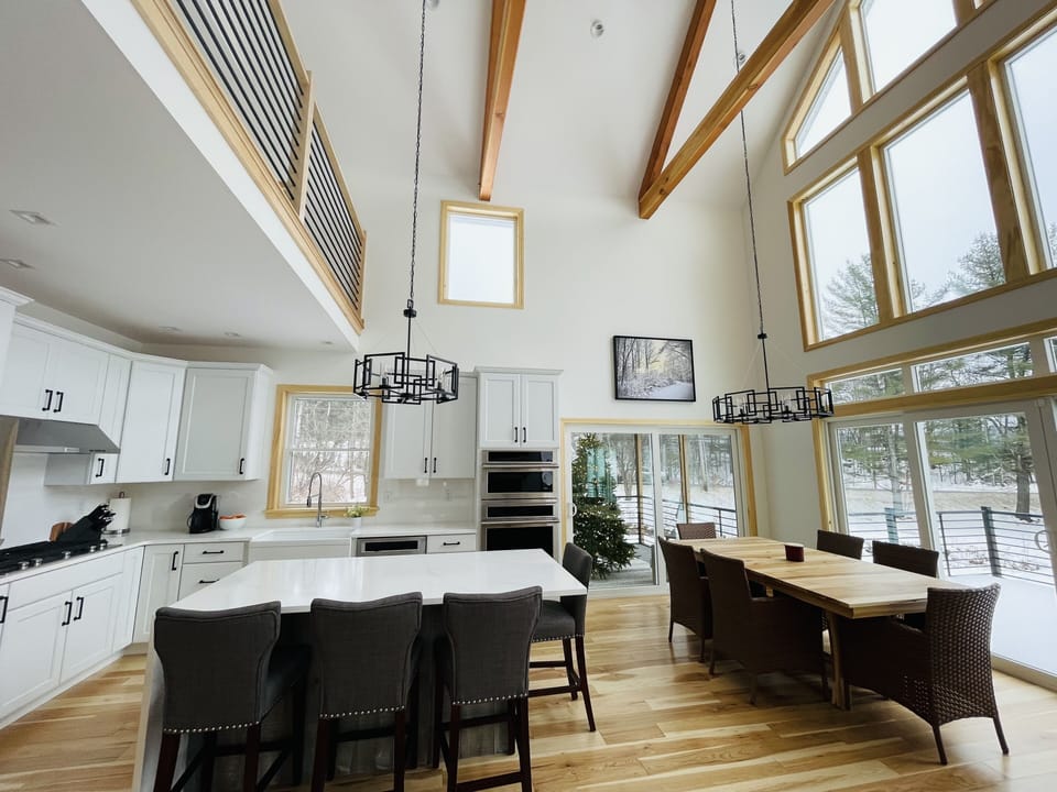 Open concept kitchen, dining room and living room. Access to screened-in porch