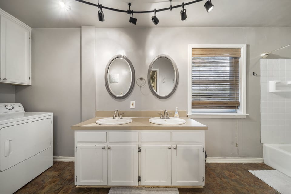 On-suite bathroom to main room with his and hers sinks.