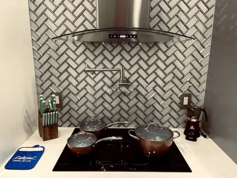 Induction cooktop with induction pans.
Martha Stewart Kitchen tools.
Pot Filler.
