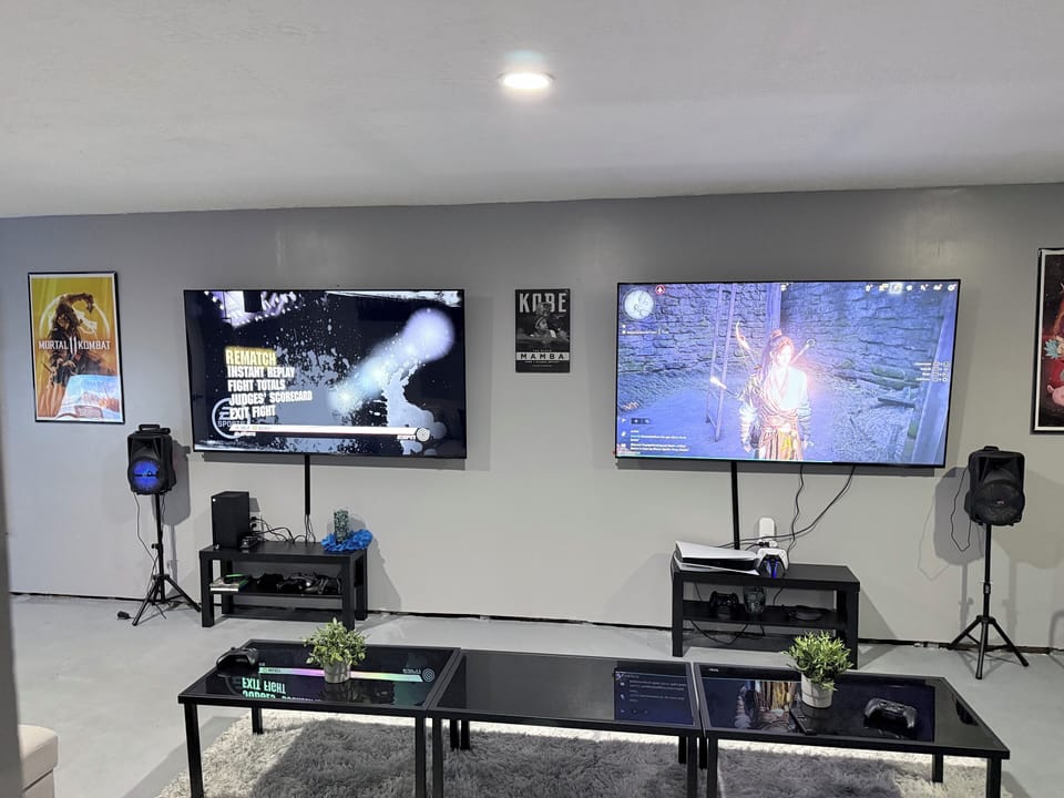 Xbox X and a Playstation 5 both with 75 inch TVs.