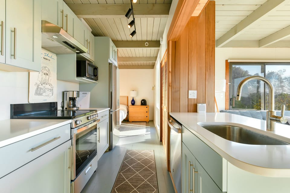 Main bedroom shown in the back.