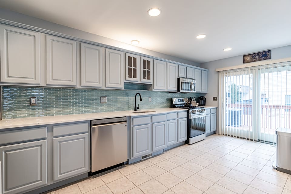 Kitchen with sliding door view to outdoor deck