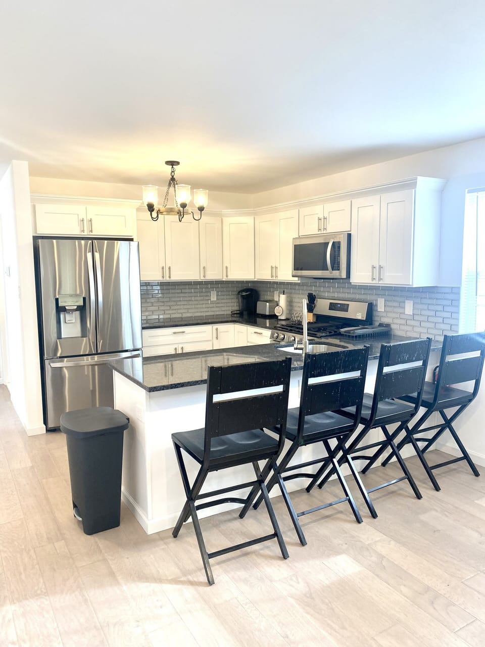 Open concept kitchen on main floor.
Gas stove, dishwasher, microwave, & fridge