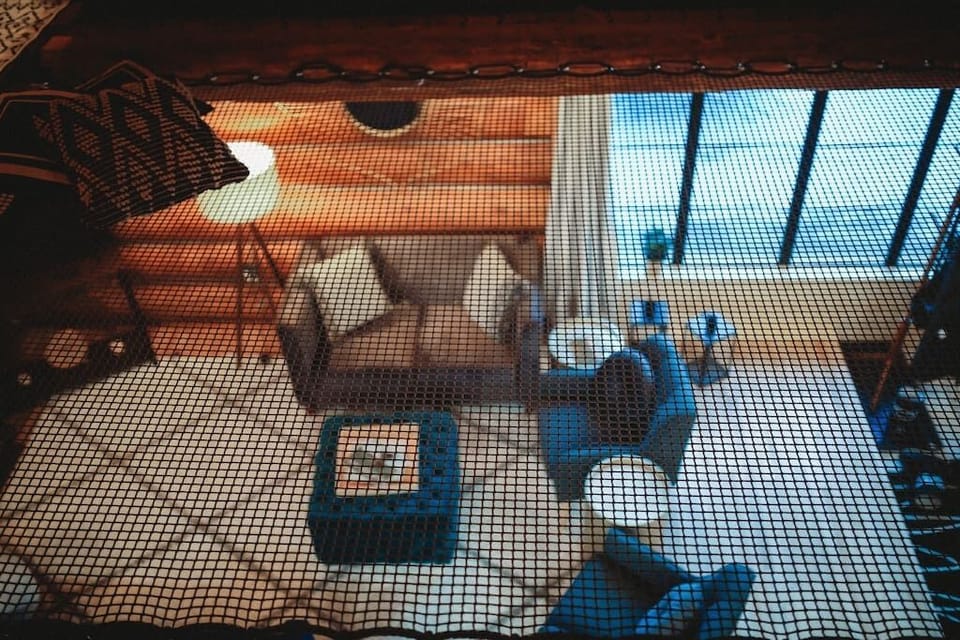 Enjoy stunning views and a cozy seating area with natural wood accents. 