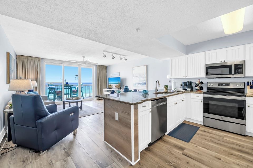 Unwind in your bright oceanfront condo where the kitchen flows into comfortable living space, all bathed in natural light from your private balcony overlooking the sea.