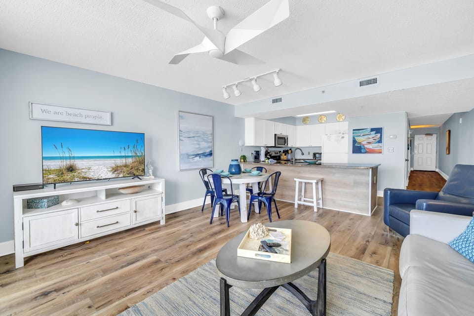 Relax in this bright, coastal-themed space where ocean blues meet modern comfort, complete with full kitchen and dining for your beach getaway.