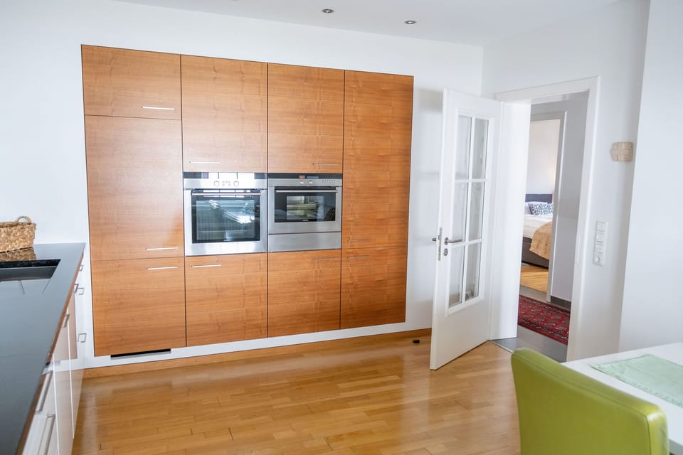 Deluxe Apartment, Private Bathroom | Private kitchen | Highchair